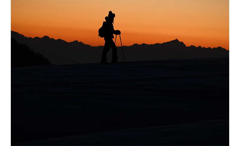 Fujifilm XF150-600mm Sample image of nordic skiier traveling across a snowy mountainscape at sun set