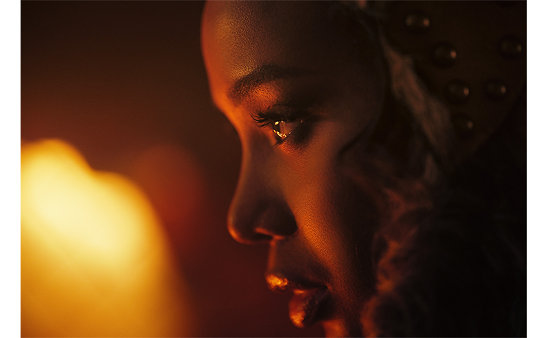 Fujifilm Fujinon XF56mm F1.2 R WR Lens sample image close up portait of a black woman lit by candle light