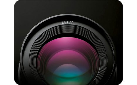 close up of the panasonic 42.5 mm f1 2 lens on a black background