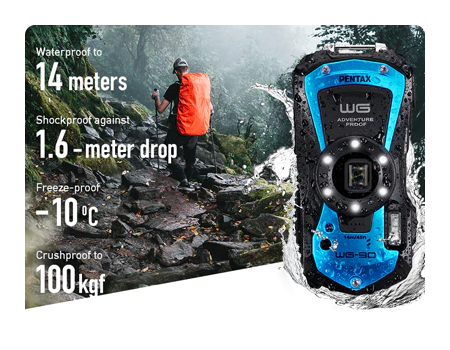 pentax camera with water splashing around it with a man hiking in the wilderness in the background and specs to the side