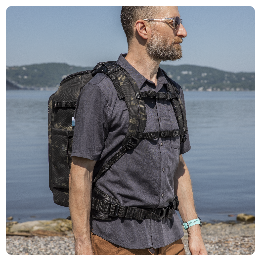 man using the backpack with the airflow harness near a lake, Tenba Axis V2 24L Backpack Multicam Black