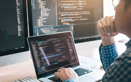 someone working on a laptop using the aja developer SDK