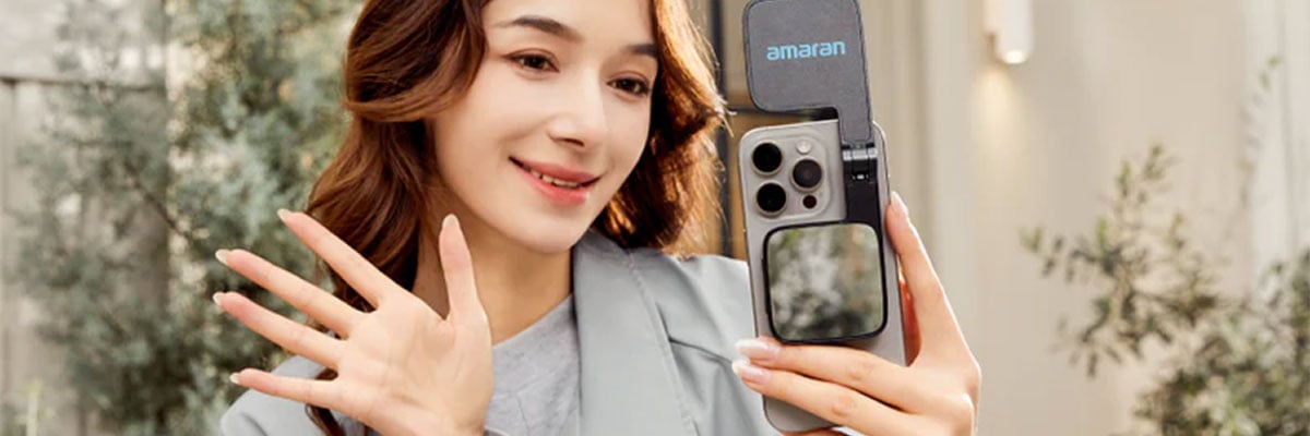 someone taking a selfie with the amaran go light attached to their phone