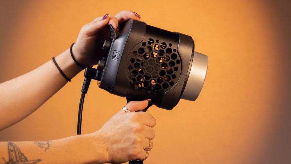 somone holding the amaran monolight