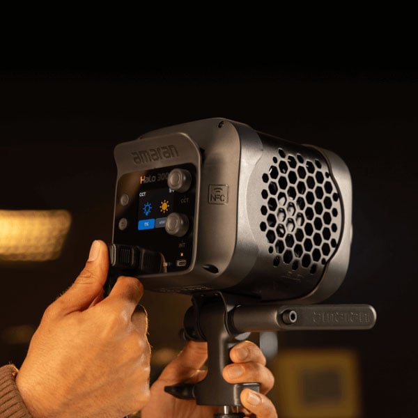 someone plugging in the amaran monolight