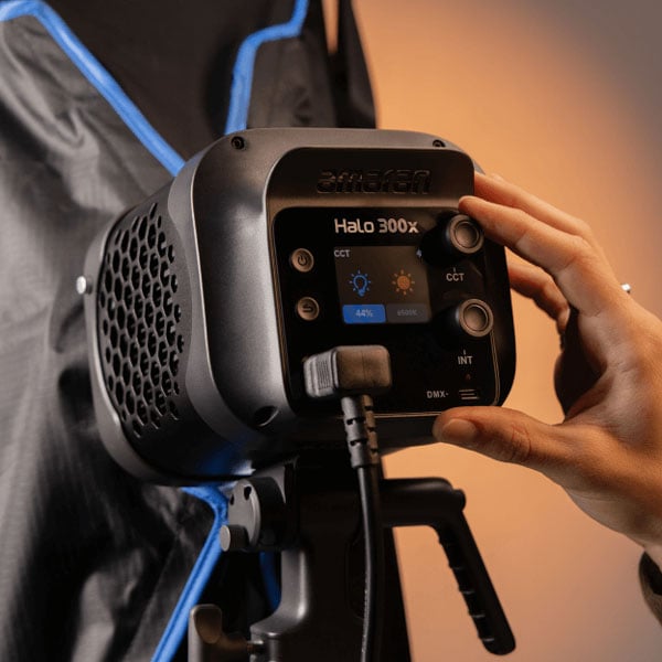 someone using the controls on the amaran monolight