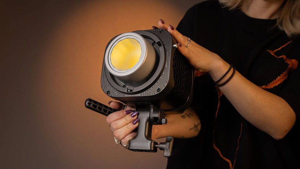 somone holding the amaran monolight