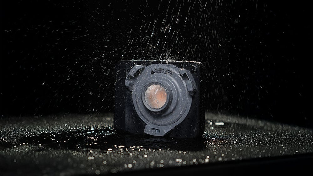 the amaran light in heavy rain on a black background