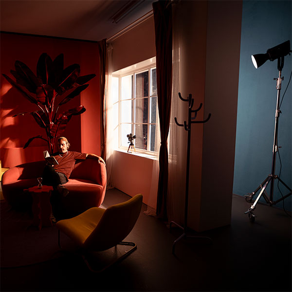 somone sat on a sofa being lit by the amaran light