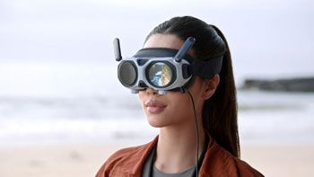 View of female drone pilot wearing Antigravity Vision FPV goggles with external display