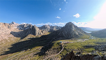 Wide FOV angle still of nordic mountain range under clear blue sky