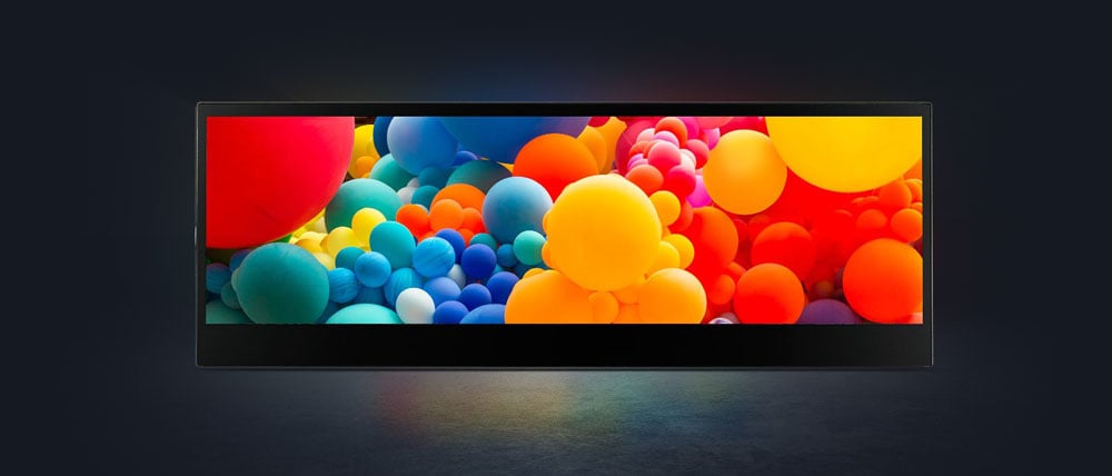 the asus proart pa147cdv touch screen monitor showing different coloured balls on a dark background