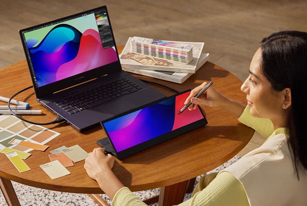 somone sketching on the asus proart pa147cdv touch screen monitor