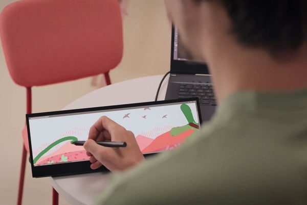 somone sketching on the asus proart pa147cdv touch screen monitor