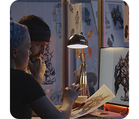 graphic designer using the asus proart pa148ctv portable monitor
