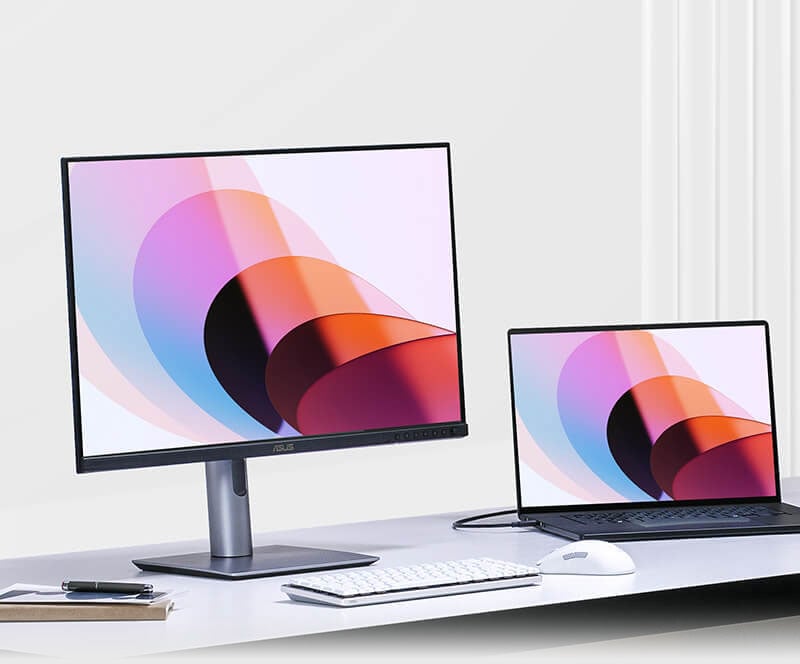asus pro art display on a desk connected to a macbook
