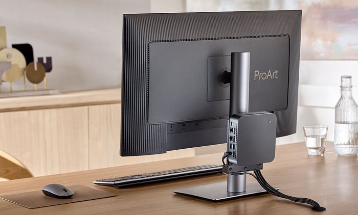 rear view of the asus pro art monitor on a desk with the asus nuc attached