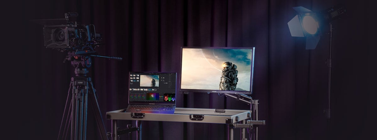 ASUS ProArt PA24US Monitor Hero Banner with DIT Cart, Camera, Pro Art Laptop and studio Light infront of a stage curtain 