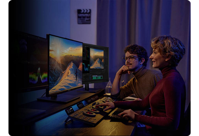 man and woman sat working at a colour grading workstation with multiple ASUS ProArt monitors