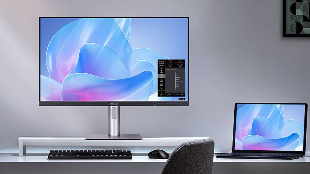 asus proart monitor connected to laptop on a desk