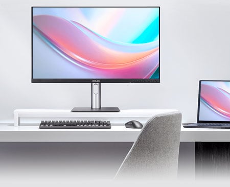 asus pro art monitor ona white desk with a macbook