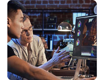 image of two video colourists reviewing colour grade on ProArt monitor