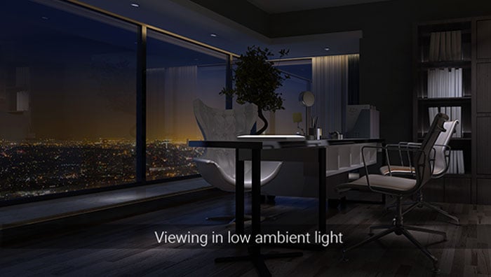 image of modern office space at night over looking a city