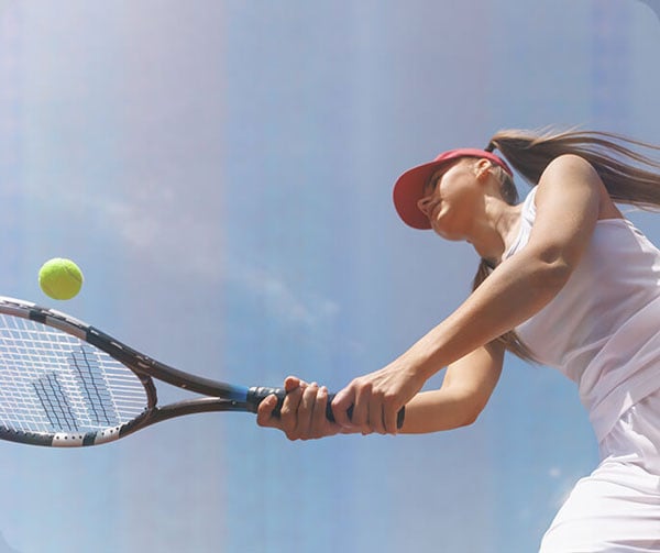 sample image of a woman playing tennis without thermal compensation