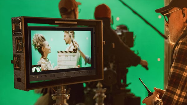 atomos shogun being useed as an on set monitor in front of a green screen