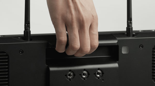 someone lifting the carry handle of the sumo pro-19