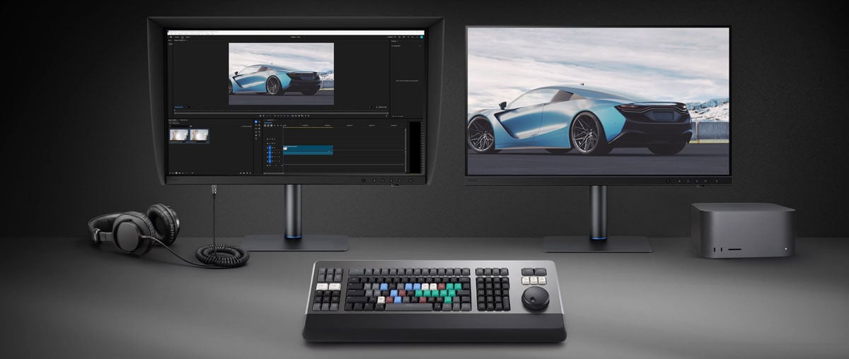 two benq monitors connected to a mac on a desk with a blackmagic atem studio