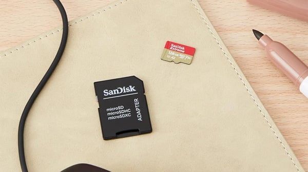 sandisk sd card with adapter on a table