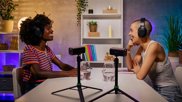 two people using the maki cameras on tripods for filming a podcast