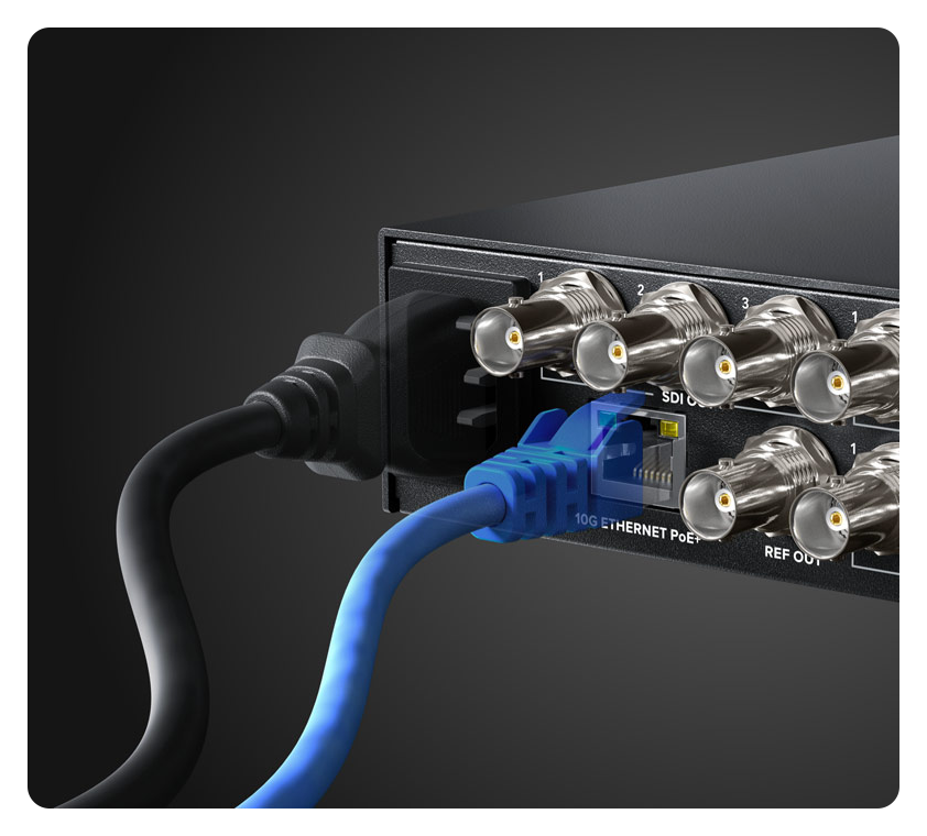 rear view of a blackmagic ip converter with ethernet and power cables connected