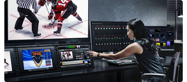 image of person working in live tv production studio with large preview monitor