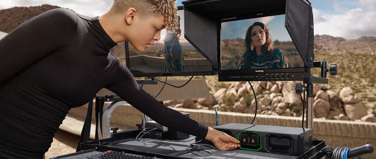 producer connecting Media Module into Media Dock on DIT cart
