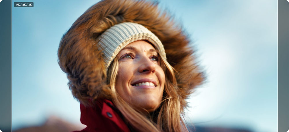 an image of a woman wearing a red jacket with a faux-fur trim hood and a knitted beanie showing aspect ratio comparison