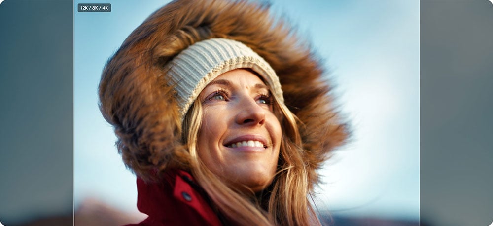 an image of a woman wearing a red jacket with a faux-fur trim hood and a knitted beanie showing aspect ratio comparison