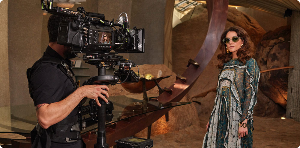 a woman being filmed on a film set using the blackmagic ursa cine