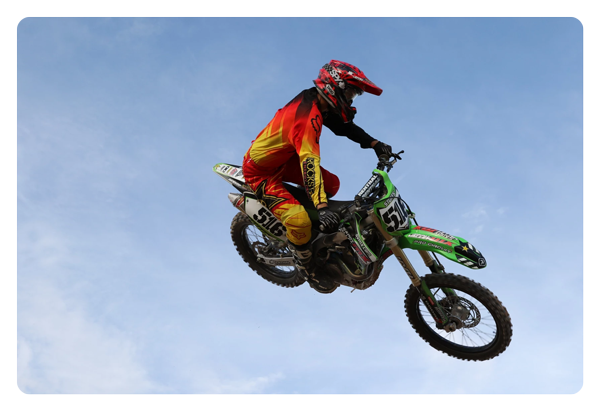 sample image of somone mid air on a motorbike taken with the canon lens