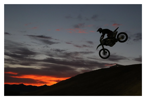 low light sample image of someone mid air on a motorbike taken with the canon lens