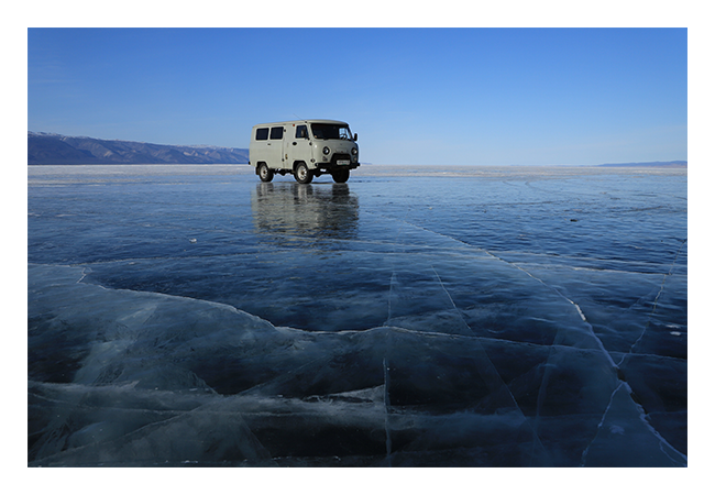 sample image of a van on a frozen lake taken with the canon lens