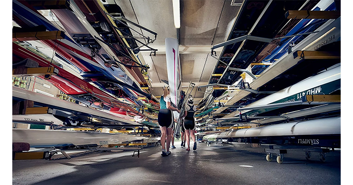 sample image of people next to rowing boats taken with the canon 35mm lens