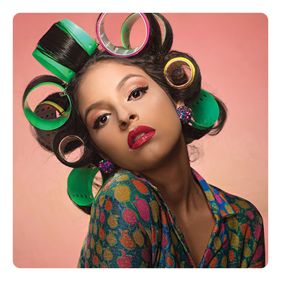 eaxmple photo of a woman posing with big curls in her hair