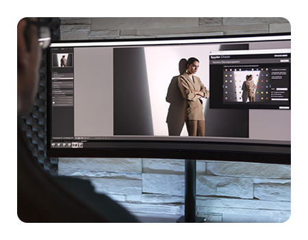 somone editing a photo on a ultra wide monitor