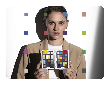 someone holding the spyder checkr photo open with reference around the photo