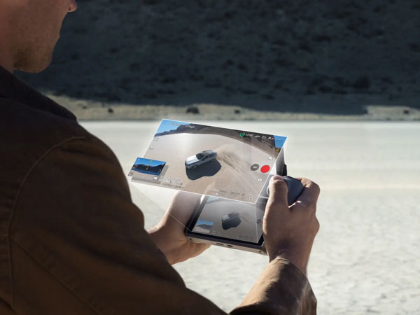 over the shoulder view of someone viewing footage taken using the dji avata 360
