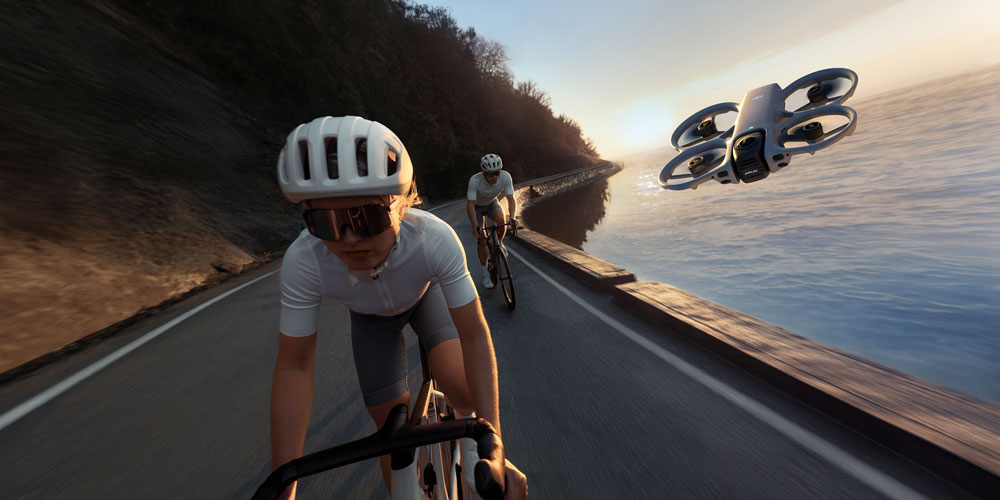 dji avata 360 flying next to 2 cyclists