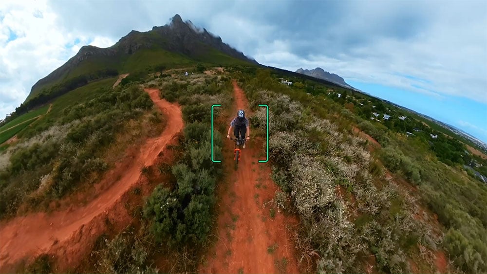 sample image of the dji avavta 360 tracking someone on a bmx going down a hill