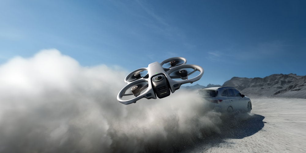 dji avata 360 flying in front of a drifting car